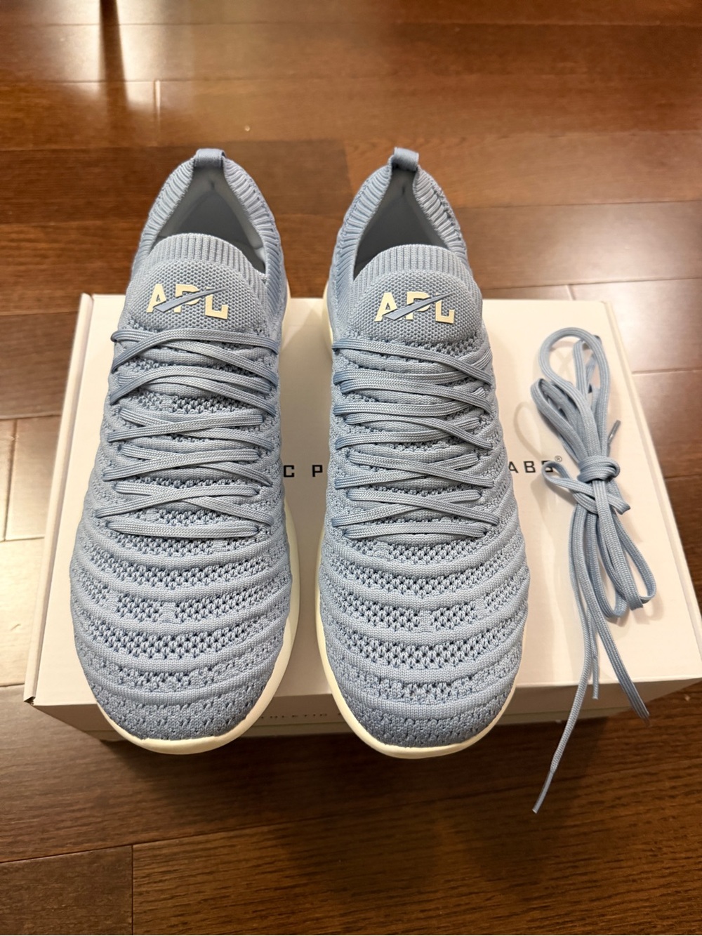 APL TechLoom Knit Slip-On Sneakers in Pale Blue and White